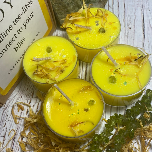 set of 4 joy tealights with peridot crystal and calendula petals