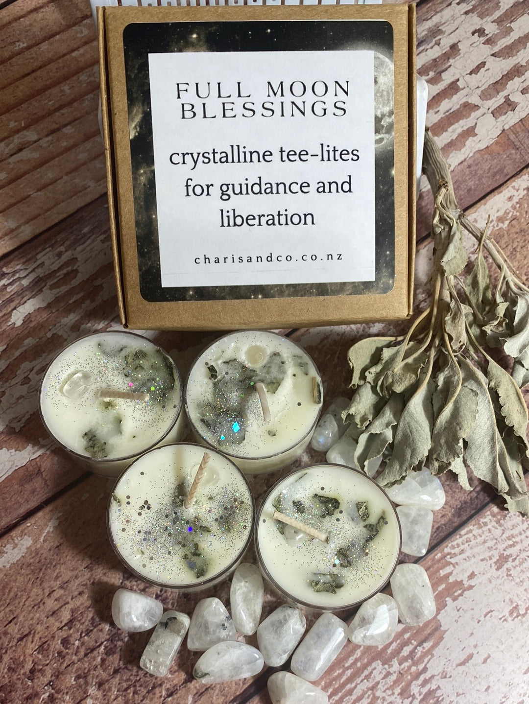 picture shows a set of full moon blessing tealights from charis and co. with white sage and moonstone crystals