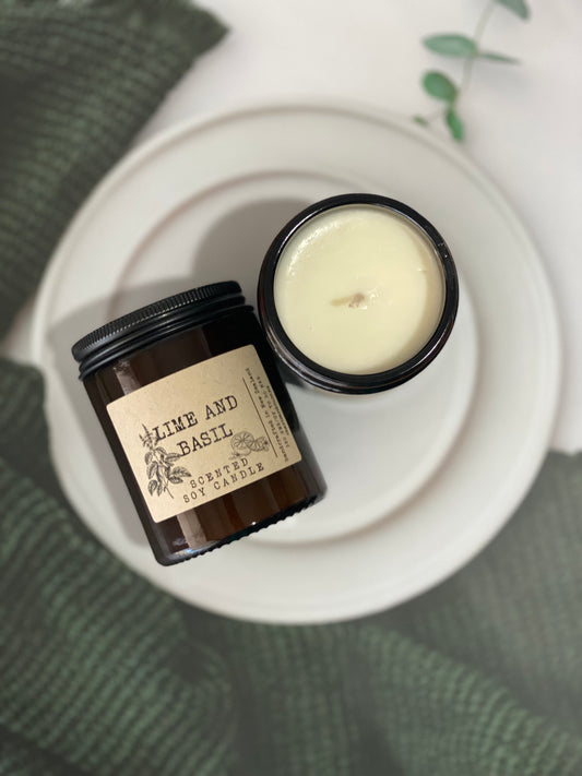 lime and basil soy candle in an amber jar