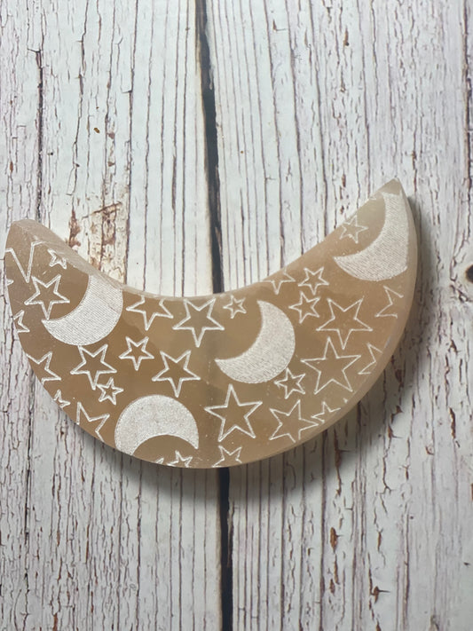 Orange Selenite crescent moon with white engraved stars and moons