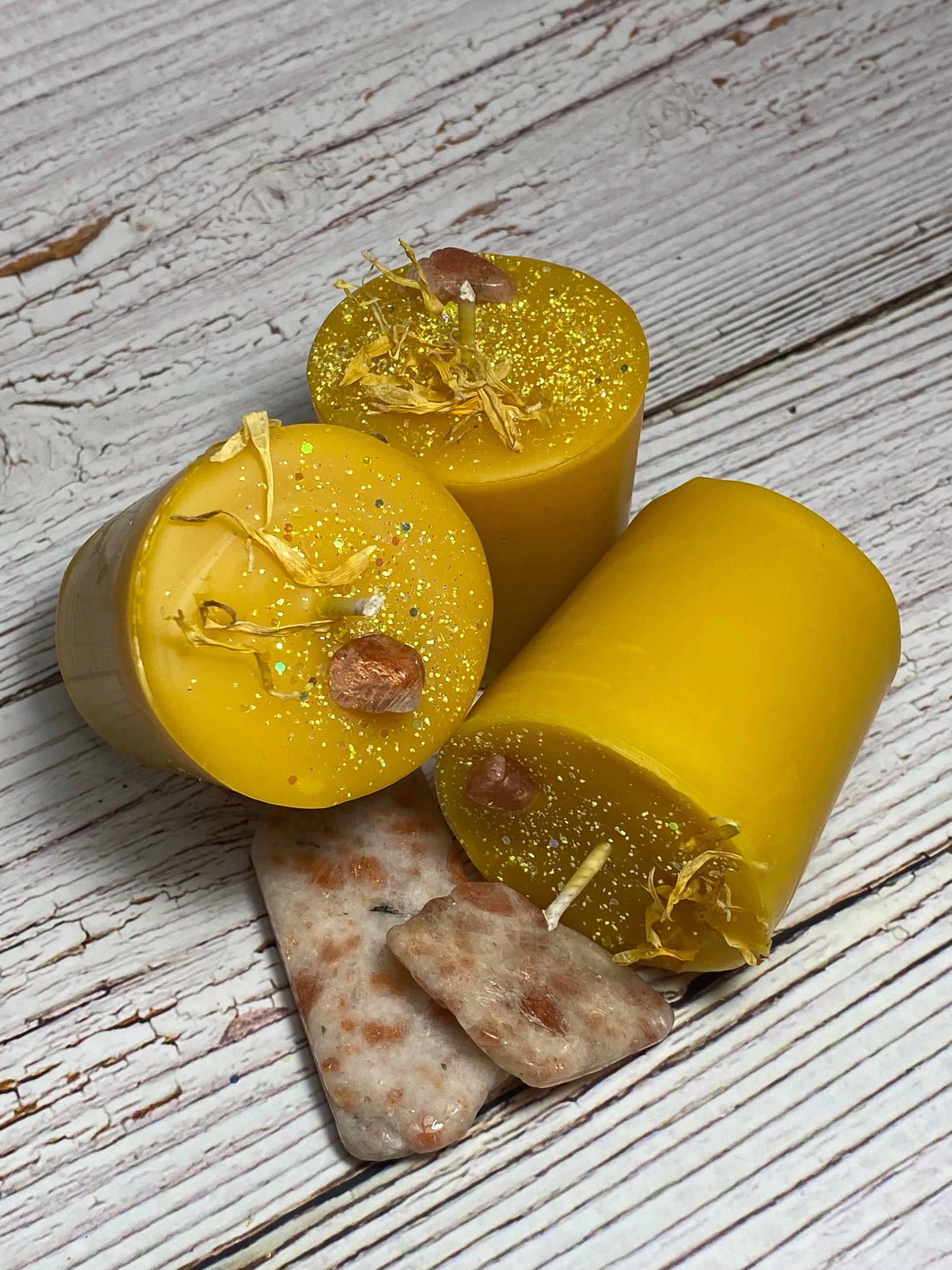 small beeswax pillar candles with sunstone crystals